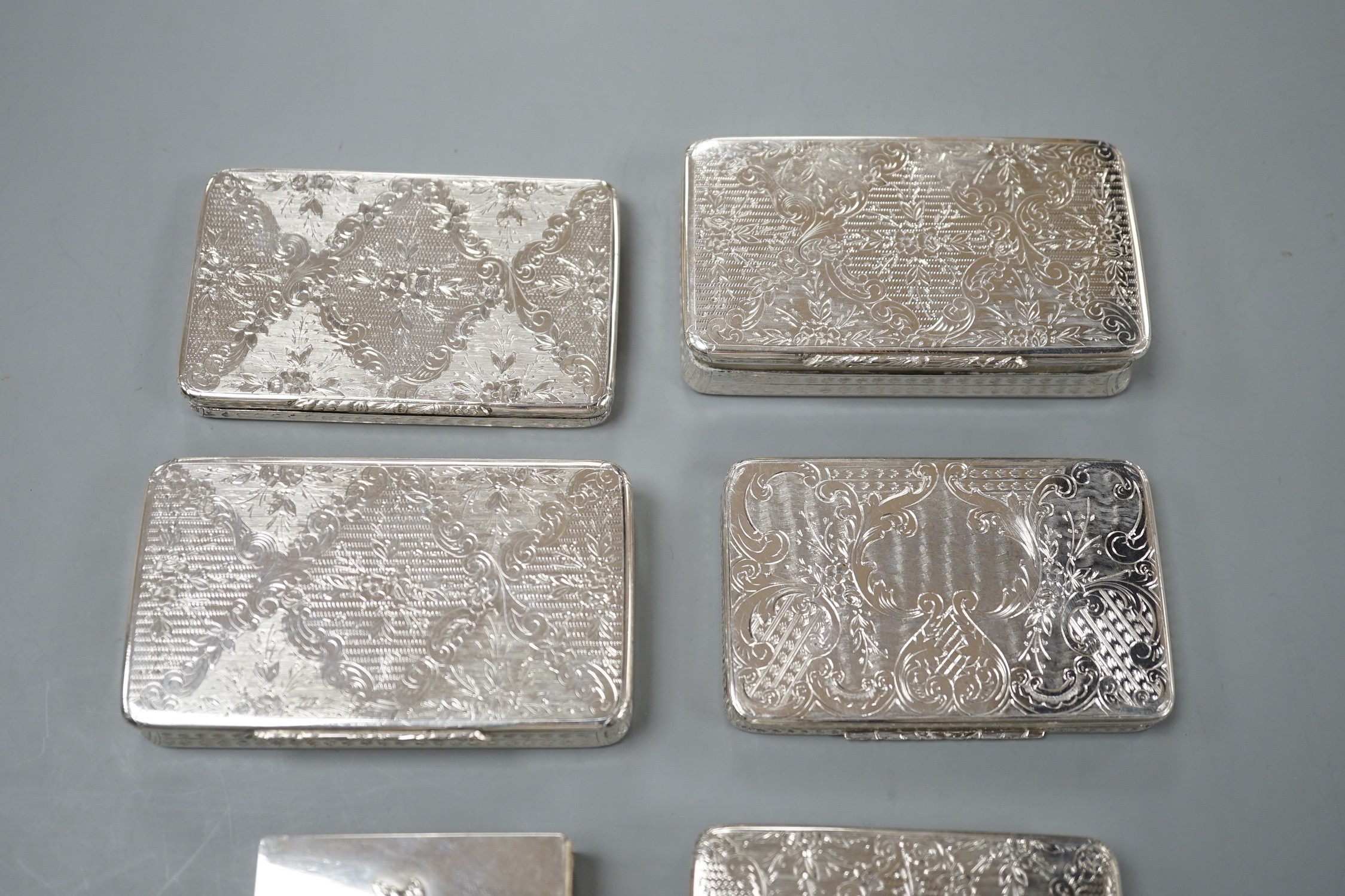 Five similar 20th century Spanish engraved white metal rectangular pill boxes, of varying sizes, largest 92mm and a 925 matchbox sleeve.
